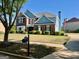 Two-story brick and siding home with well-kept landscaping at 1600 Prospect Pl, Locust Grove, GA 30248