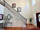 Grand foyer with a staircase, high ceilings, decorative lighting, and attractive decor at 1600 Prospect Pl, Locust Grove, GA 30248