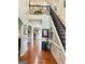 Elegant foyer boasting hardwood floors, wainscoting, and a staircase leading to the upper level at 1600 Prospect Pl, Locust Grove, GA 30248