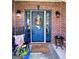 Inviting front entrance with decorative wreath, sidelights, and traditional brick facade at 1600 Prospect Pl, Locust Grove, GA 30248