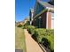 Front walkway view of the home's brick exterior and manicured shrubbery at 1600 Prospect Pl, Locust Grove, GA 30248