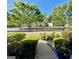 Picturesque view of the front yard featuring well-maintained landscaping and mature shade trees at 1600 Prospect Pl, Locust Grove, GA 30248