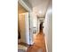Hallway with hardwood floors leading to other rooms at 1600 Prospect Pl, Locust Grove, GA 30248