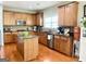 Well-equipped kitchen featuring a central island, stainless steel appliances, and ample counter space at 1600 Prospect Pl, Locust Grove, GA 30248