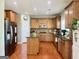 Spacious kitchen with a central island, stainless steel appliances, and ample cabinet space at 1600 Prospect Pl, Locust Grove, GA 30248