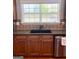 A kitchen sink with stainless steel dishwasher and granite countertops at 1600 Prospect Pl, Locust Grove, GA 30248