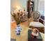 Detailed close-up showcasing a styled coffee table, vase, and chair in a cozy living room at 1600 Prospect Pl, Locust Grove, GA 30248