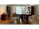 Bright living room with a neutral color scheme, hardwood floors, and a comfortable sofa at 1600 Prospect Pl, Locust Grove, GA 30248