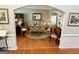 Cozy living room with hardwood floors, arched entryway, and elegant decor, perfect for relaxation at 1600 Prospect Pl, Locust Grove, GA 30248