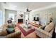 Comfortable living room with fireplace and hardwood floors, filled with natural light at 1600 Prospect Pl, Locust Grove, GA 30248