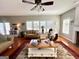 Open living area with hardwood floors, fireplace, and plenty of natural light at 1600 Prospect Pl, Locust Grove, GA 30248