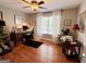 Office featuring hardwood floors, window, and wooden desk at 1600 Prospect Pl, Locust Grove, GA 30248