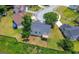Aerial view of the house, backyard, deck, and surrounding neighborhood, with mature trees at 8103 Rhodes Way, Riverdale, GA 30274