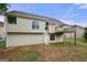 View of the home's back exterior, showcasing the deck and spacious yard at 8103 Rhodes Way, Riverdale, GA 30274