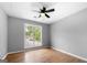 Bedroom with a large window overlooking the front yard, allowing for ample natural light at 8103 Rhodes Way, Riverdale, GA 30274