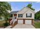 Charming two-story home with brick and siding exterior, two-car garage, and manicured landscaping at 8103 Rhodes Way, Riverdale, GA 30274