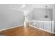 Second floor hallway showing lighting and flooring at 8103 Rhodes Way, Riverdale, GA 30274