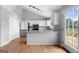 Kitchen with granite countertops, stainless appliances, pantry, tile backsplash, and access to the back deck at 8103 Rhodes Way, Riverdale, GA 30274