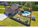 Aerial view of a spacious backyard featuring a pool, gazebo, and recreational area with trampoline at 4402 Kady Ct, Mcdonough, GA 30252