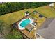Aerial view of a backyard featuring a pool, gazebo, lounge seating, play equipment and large lawn at 4402 Kady Ct, Mcdonough, GA 30252