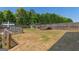 Large backyard featuring a trampoline and playground with fence at 4402 Kady Ct, Mcdonough, GA 30252