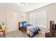 Bedroom with a large window with natural light, decorated with playful accents at 4402 Kady Ct, Mcdonough, GA 30252