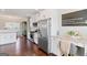 Bright kitchen featuring stainless steel appliances, granite countertops, and white cabinetry at 4402 Kady Ct, Mcdonough, GA 30252