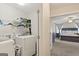 Convenient laundry room situated near the Primary bedroom with washer, dryer, and shelving at 4402 Kady Ct, Mcdonough, GA 30252