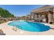 Inviting backyard pool area with a gazebo, comfortable seating, and a diving board at 4402 Kady Ct, Mcdonough, GA 30252