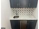 Home bar area with a beverage cooler, sink, and tile backsplash at 906 Winall Down Ne Rd, Atlanta, GA 30319