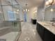 Bright and airy bathroom with marble floors, double vanities, walk-in shower, and soaking tub at 906 Winall Down Ne Rd, Atlanta, GA 30319