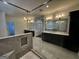 Spacious bathroom with marble floors, dual vanities, and a glass-enclosed shower, exuding modern luxury at 906 Winall Down Ne Rd, Atlanta, GA 30319