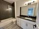 Stylish bathroom features modern vanity and tiled shower with glass door at 906 Winall Down Ne Rd, Atlanta, GA 30319