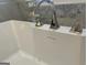 Close up of a soaking bathtub with a chrome faucet, designed for relaxation at 906 Winall Down Ne Rd, Atlanta, GA 30319