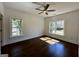 Comfortable bedroom with hardwood floors, a ceiling fan, and two windows offering lots of light at 906 Winall Down Ne Rd, Atlanta, GA 30319