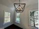 Bright bedroom with modern chandelier lighting fixture, with view of outdoor pool at 906 Winall Down Ne Rd, Atlanta, GA 30319