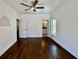 Bedroom featuring hardwood floors and a view into a bathroom, creating a modern aesthetic at 906 Winall Down Ne Rd, Atlanta, GA 30319