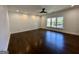 Spacious bedroom featuring hardwood floors, a ceiling fan, and natural light from the window at 906 Winall Down Ne Rd, Atlanta, GA 30319