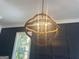 Close up of a decorative chandelier with window view at 906 Winall Down Ne Rd, Atlanta, GA 30319