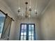 Chandelier fixture over doorway leading to outdoor patio at 906 Winall Down Ne Rd, Atlanta, GA 30319