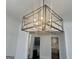 Unique, modern chandelier over open room with bar and kitchen access at 906 Winall Down Ne Rd, Atlanta, GA 30319