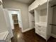 Walk-in closet featuring custom shelving and cabinets at 906 Winall Down Ne Rd, Atlanta, GA 30319