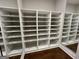 Walk-in closet featuring custom shelves and dark hardwood flooring at 906 Winall Down Ne Rd, Atlanta, GA 30319
