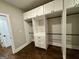 Walk-in closet features custom shelving and ample storage space at 906 Winall Down Ne Rd, Atlanta, GA 30319