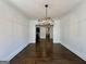 Open dining room featuring hardwood floors and modern chandelier at 906 Winall Down Ne Rd, Atlanta, GA 30319
