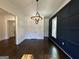 Dining room featuring modern light fixture, millwork, and dark hardwood floors at 906 Winall Down Ne Rd, Atlanta, GA 30319