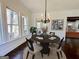 Bright dining area featuring a dark wood table, natural light, and stylish decor at 906 Winall Down Ne Rd, Atlanta, GA 30319