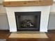 Elegant fireplace with a wooden mantel and modern gas logs, perfect for cozy evenings at 906 Winall Down Ne Rd, Atlanta, GA 30319