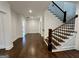 Open foyer with hardwood flooring and staircase with wooden railing at 906 Winall Down Ne Rd, Atlanta, GA 30319