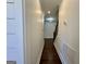 Hallway with dark hardwood floors leading to a staircase at 906 Winall Down Ne Rd, Atlanta, GA 30319